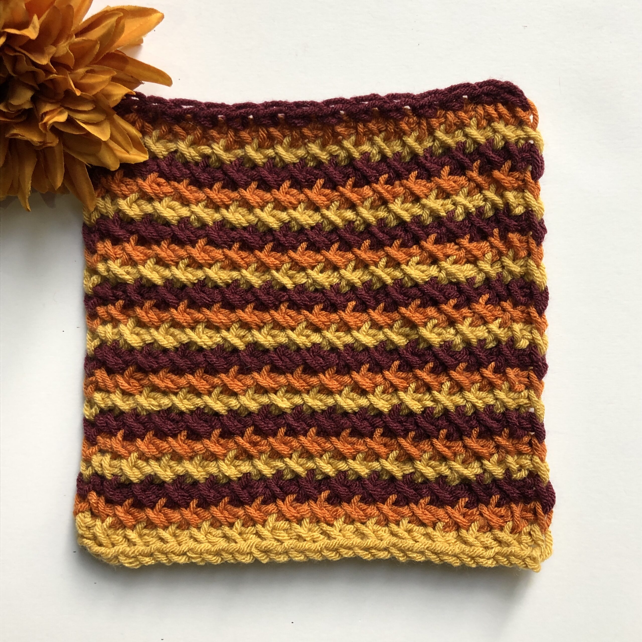 Tunisian blanket square in the colors of mulled wine.