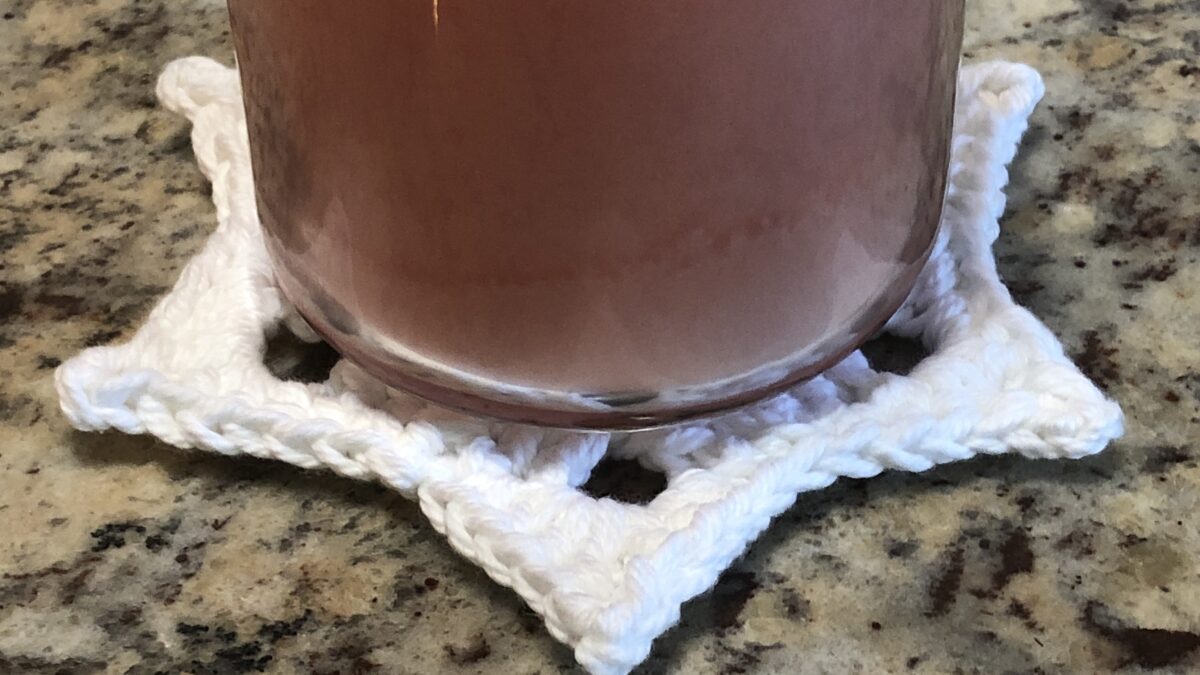 candle on top of a star trivet